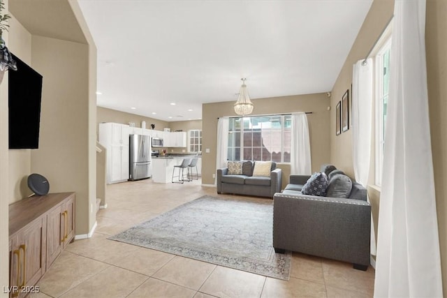 9869 Lime Tree St, Las Vegas, NV 89178 - living area featuring light tile patterned floors, baseboards, and recessed lighting