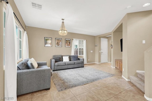 9869 Lime Tree St, Las Vegas, NV 89178 - living room with light tile patterned flooring, baseboards, stairs, and a chandelier