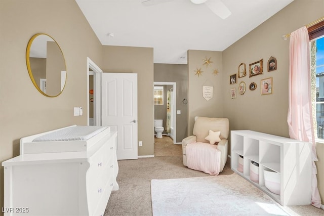 9869 Lime Tree St, Las Vegas, NV 89178 - bedroom featuring light colored carpet, multiple windows, ceiling fan, and baseboards