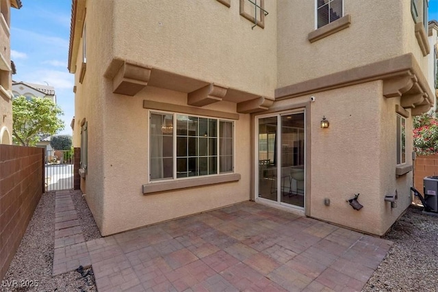 9869 Lime Tree St, Las Vegas, NV 89178 - view of patio featuring a gate and cooling unit