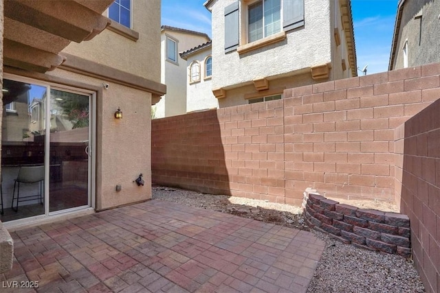 9869 Lime Tree St, Las Vegas, NV 89178 - fenced backyard with a patio