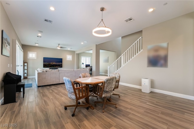 2575 Hazelburn Ave, Henderson, NV 89044 - dining area with light wood-style flooring, baseboards, stairway, recessed lighting, and ceiling fan