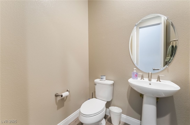 2575 Hazelburn Ave, Henderson, NV 89044 - half bath featuring toilet and baseboards