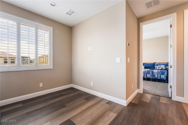 2575 Hazelburn Ave, Henderson, NV 89044 - empty room featuring dark wood-type flooring, baseboards, and recessed lighting