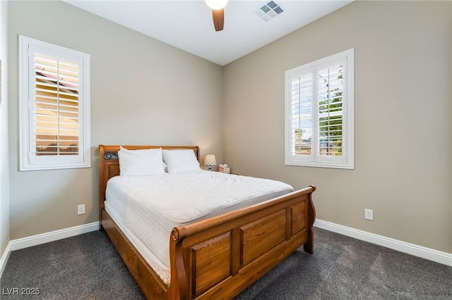2575 Hazelburn Ave, Henderson, NV 89044 - bedroom with baseboards, dark carpet, and ceiling fan