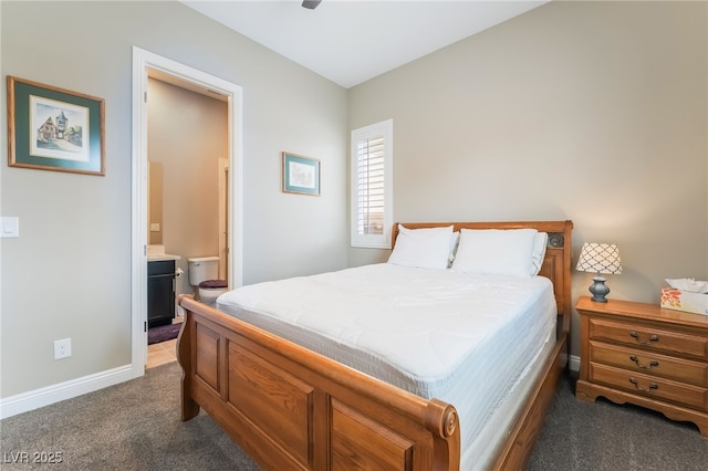 2575 Hazelburn Ave, Henderson, NV 89044 - carpeted bedroom featuring baseboards and connected bathroom