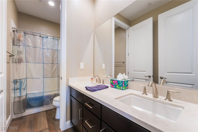 2575 Hazelburn Ave, Henderson, NV 89044 - full bath with toilet, double vanity, wood finished floors, and shower / tub combo with curtain