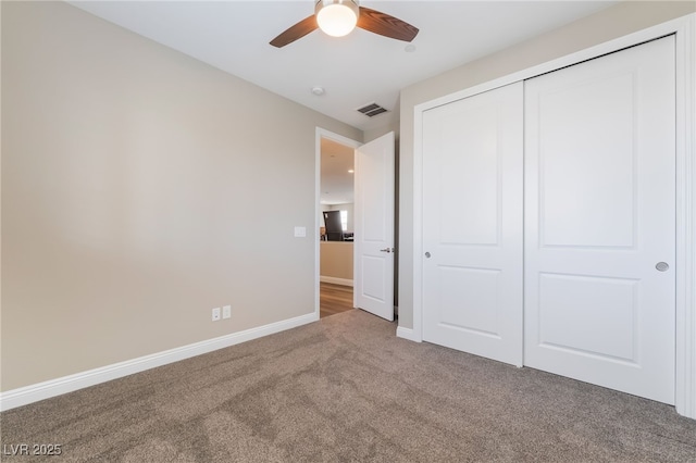 2575 Hazelburn Ave, Henderson, NV 89044 - unfurnished bedroom with carpet, baseboards, a closet, and a ceiling fan