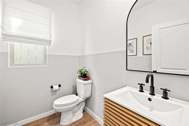 11652 Desert Hollow Ave, Las Vegas, NV 89138 - bathroom with wood finished floors, toilet, baseboards, and vanity