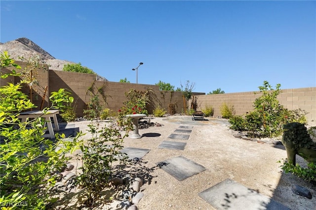11652 Desert Hollow Ave, Las Vegas, NV 89138 - fenced backyard featuring a patio