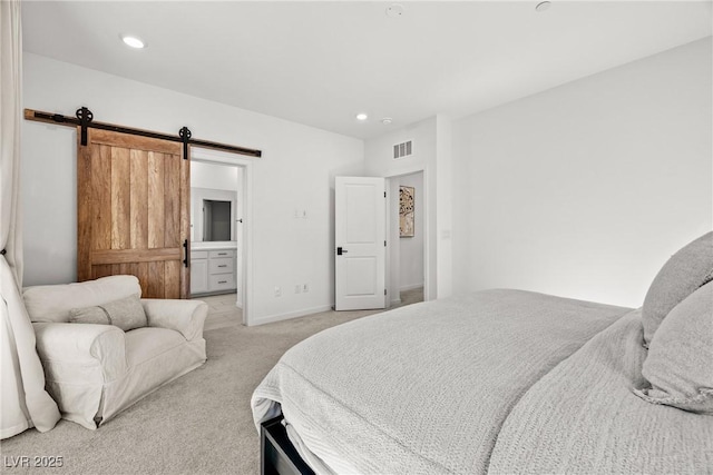 11652 Desert Hollow Ave, Las Vegas, NV 89138 - bedroom featuring light carpet, a barn door, recessed lighting, and baseboards
