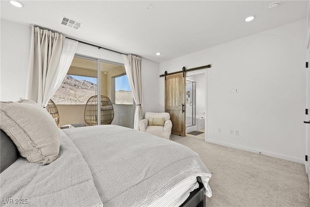 11652 Desert Hollow Ave, Las Vegas, NV 89138 - bedroom with light carpet, recessed lighting, a barn door, baseboards, and ensuite bath