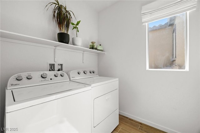 11652 Desert Hollow Ave, Las Vegas, NV 89138 - laundry area with washing machine and clothes dryer, light wood-style floors, and baseboards