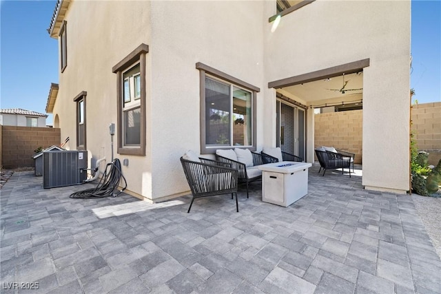 11652 Desert Hollow Ave, Las Vegas, NV 89138 - view of patio / terrace with central AC and an outdoor living space with a fire pit
