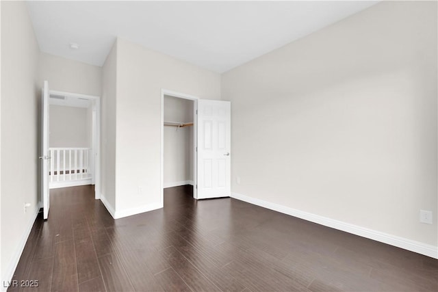 367 Wilford Springs St, Henderson, NV 89014 - unfurnished bedroom with dark wood-style flooring, a closet, and baseboards