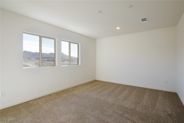 89 Via Franello, Henderson, NV 89011 - carpeted spare room featuring a mountain view, baseboards, and recessed lighting