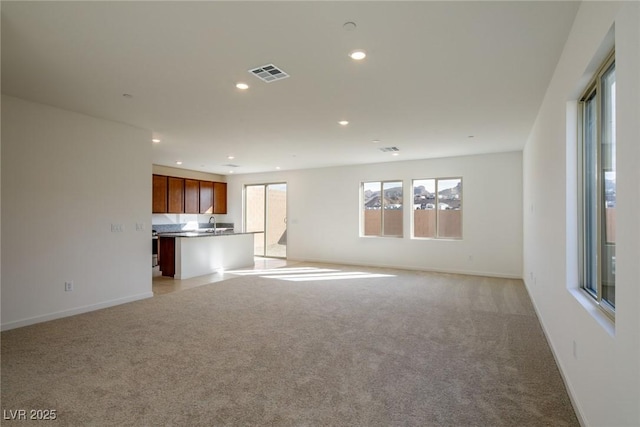 89 Via Franello, Henderson, NV 89011 - unfurnished living room featuring light carpet, recessed lighting, and baseboards