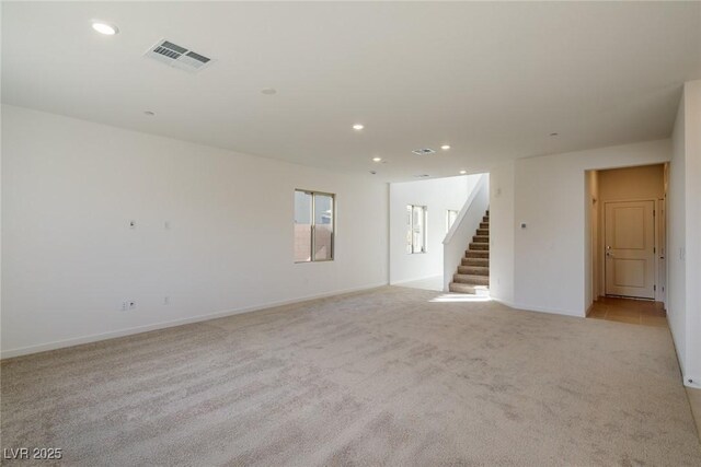 89 Via Franello, Henderson, NV 89011 - unfurnished room featuring light colored carpet, stairs, recessed lighting, and baseboards