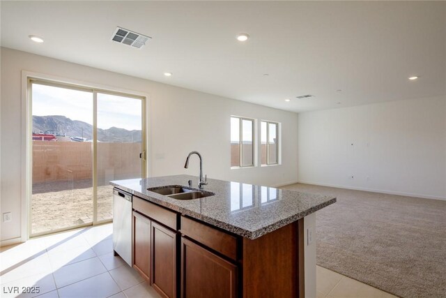 89 Via Franello, Henderson, NV 89011 - kitchen featuring a sink, dishwasher, light stone countertops, a mountain view, and a center island with sink