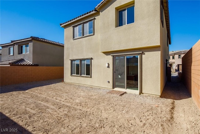 89 Via Franello, Henderson, NV 89011 - back of house featuring stucco siding, a fenced backyard, and a patio