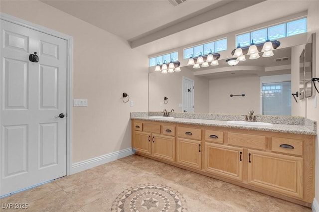 1312 Fragrant Spruce Ave, Las Vegas, NV 89123 - full bathroom featuring double vanity and baseboards