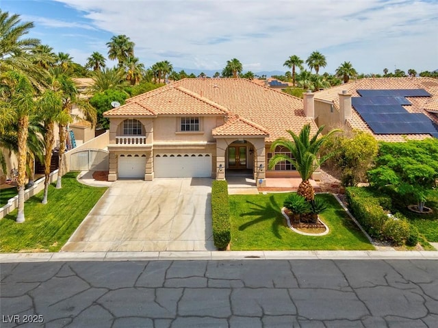 1312 Fragrant Spruce Ave, Las Vegas, NV 89123 - mediterranean / spanish-style house featuring stucco siding, french doors, a front lawn, and driveway