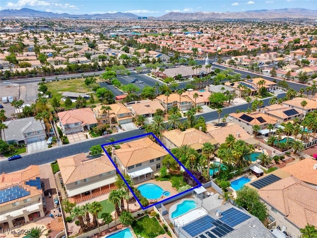 1312 Fragrant Spruce Ave, Las Vegas, NV 89123 - aerial perspective of suburban area with property boundaries highlighted, a pool, and mountains