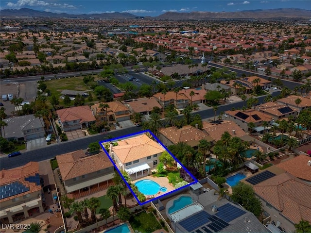 1312 Fragrant Spruce Ave, Las Vegas, NV 89123 - aerial perspective of suburban area with a mountainous background, a pool area, and property parcel outlined