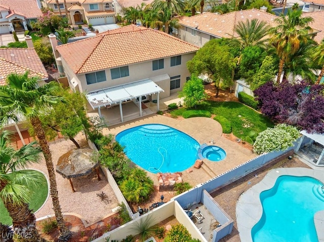 1312 Fragrant Spruce Ave, Las Vegas, NV 89123 - view of pool featuring a fenced backyard, a pool with connected hot tub, a residential view, and a patio area