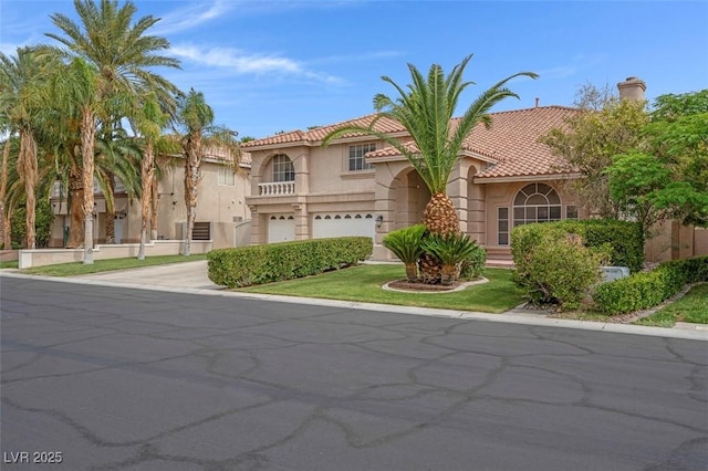 1312 Fragrant Spruce Ave, Las Vegas, NV 89123 - mediterranean / spanish home with a garage, stucco siding, driveway, and a tiled roof