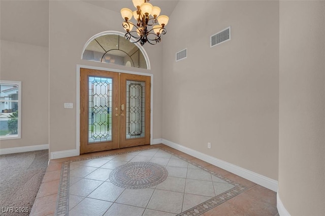 1312 Fragrant Spruce Ave, Las Vegas, NV 89123 - foyer featuring french doors, baseboards, a chandelier, inlaid floor details, and a high ceiling