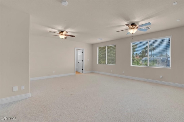 1312 Fragrant Spruce Ave, Las Vegas, NV 89123 - spare room featuring ceiling fan, a smoke detector, light colored carpet, and baseboards