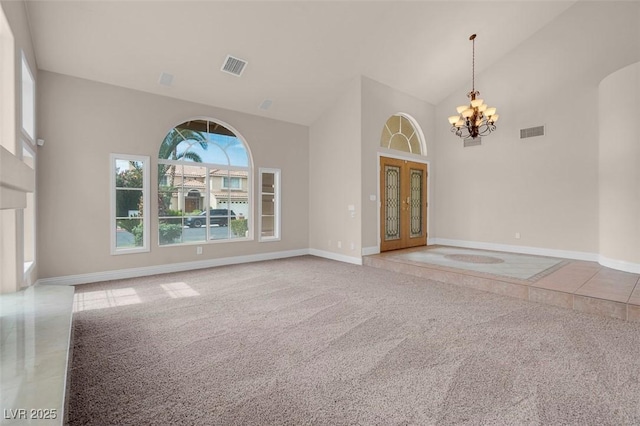 1312 Fragrant Spruce Ave, Las Vegas, NV 89123 - spare room with high vaulted ceiling, a chandelier, carpet floors, baseboards, and french doors