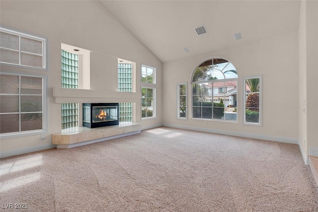 1312 Fragrant Spruce Ave, Las Vegas, NV 89123 - unfurnished living room with high vaulted ceiling, carpet, baseboards, and a fireplace