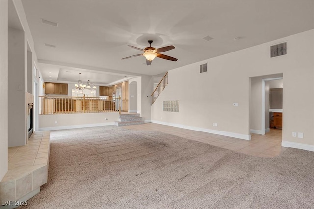 1312 Fragrant Spruce Ave, Las Vegas, NV 89123 - unfurnished living room featuring light carpet, light tile patterned floors, a chandelier, a ceiling fan, and baseboards