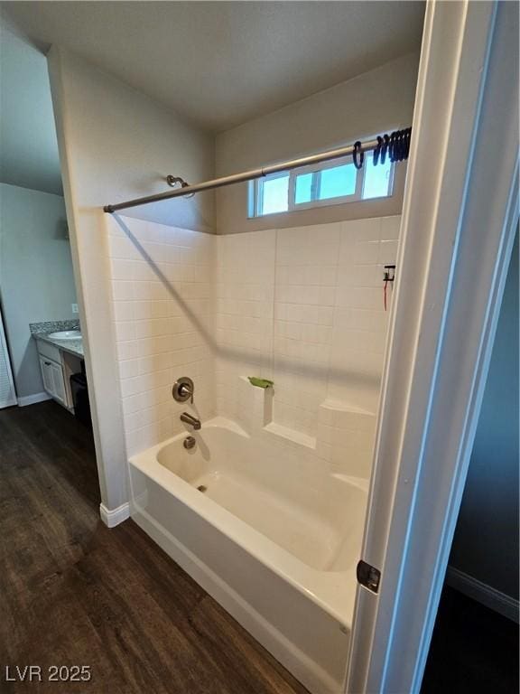 1870 Upland Ave, Pahrump, NV 89048 - full bathroom featuring wood finished floors, bathtub / shower combination, vanity, and baseboards