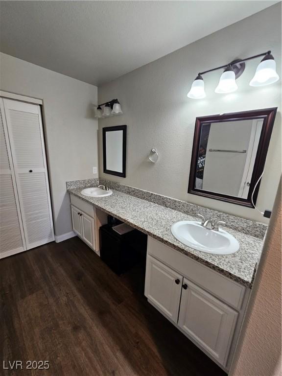 1870 Upland Ave, Pahrump, NV 89048 - full bath featuring wood finished floors, double vanity, and baseboards