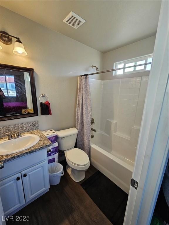 1870 Upland Ave, Pahrump, NV 89048 - full bathroom featuring toilet, wood finished floors, vanity, and shower / tub combo