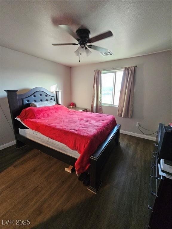 1870 Upland Ave, Pahrump, NV 89048 - bedroom featuring wood finished floors, baseboards, a ceiling fan, and a textured ceiling