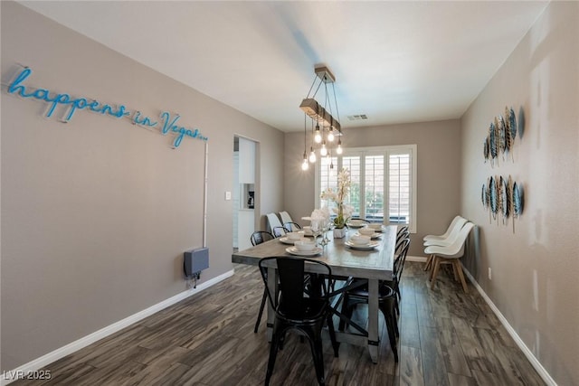 6251 Tuckaway Cove Ave, Las Vegas, NV 89139 - dining area featuring dark wood-style flooring and baseboards