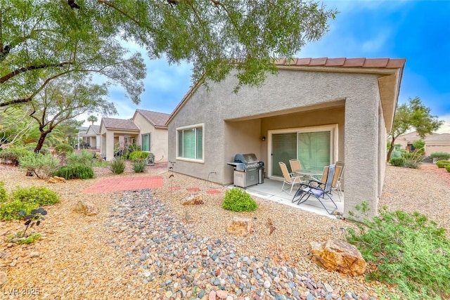 2522 Darda St, Henderson, NV 89044 - back of property featuring stucco siding and a patio