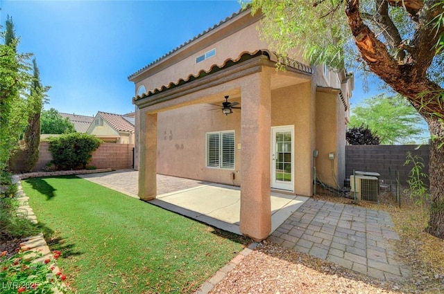 5931 Allanche Ave, Las Vegas, NV 89141 - back of house with ceiling fan, stucco siding, a fenced backyard, and a patio area