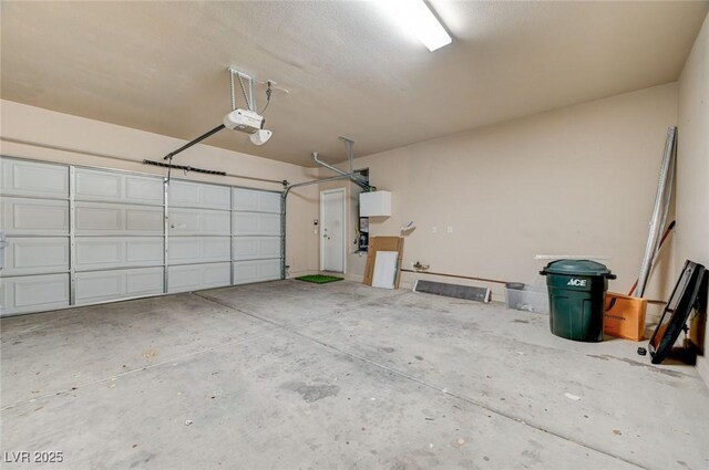 5931 Allanche Ave, Las Vegas, NV 89141 - garage featuring a garage door opener