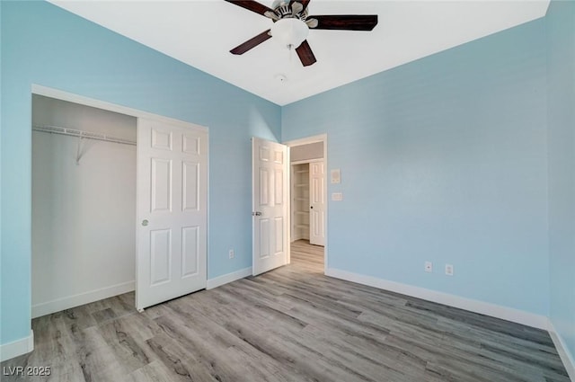 5931 Allanche Ave, Las Vegas, NV 89141 - unfurnished bedroom with wood finished floors, a closet, and a ceiling fan
