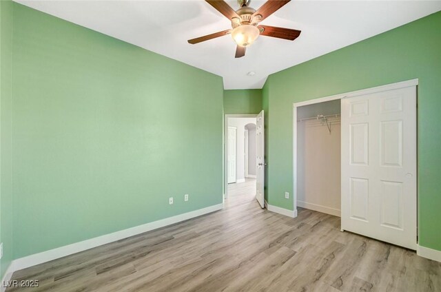 5931 Allanche Ave, Las Vegas, NV 89141 - unfurnished bedroom with wood finished floors, a closet, and a ceiling fan
