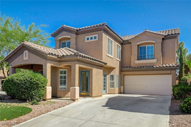 5931 Allanche Ave, Las Vegas, NV 89141 - view of front of house with a tiled roof, stucco siding, concrete driveway, and an attached garage