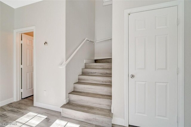 5931 Allanche Ave, Las Vegas, NV 89141 - staircase featuring wood finished floors and baseboards
