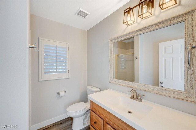 5931 Allanche Ave, Las Vegas, NV 89141 - bathroom featuring vanity, an enclosed shower, and wood finished floors