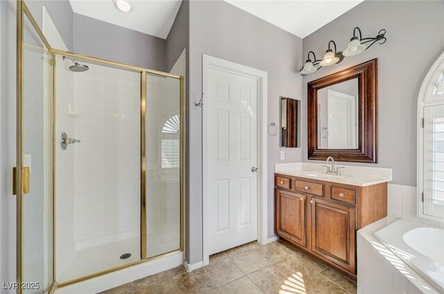 5931 Allanche Ave, Las Vegas, NV 89141 - bathroom with a stall shower, a garden tub, vanity, and tile patterned floors