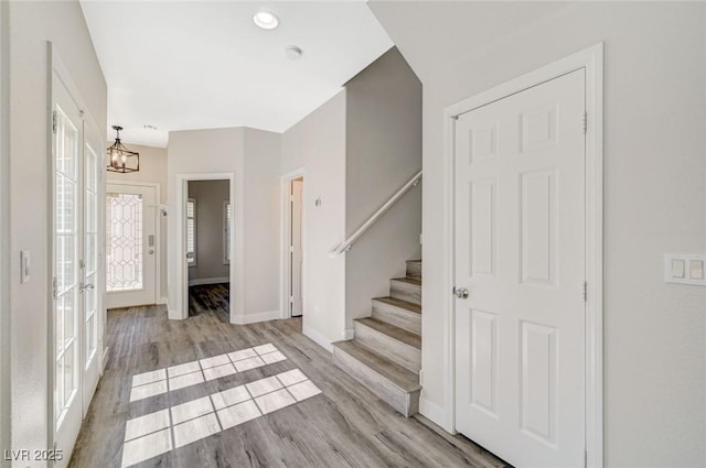 5931 Allanche Ave, Las Vegas, NV 89141 - foyer entrance with stairs, a chandelier, and wood finished floors